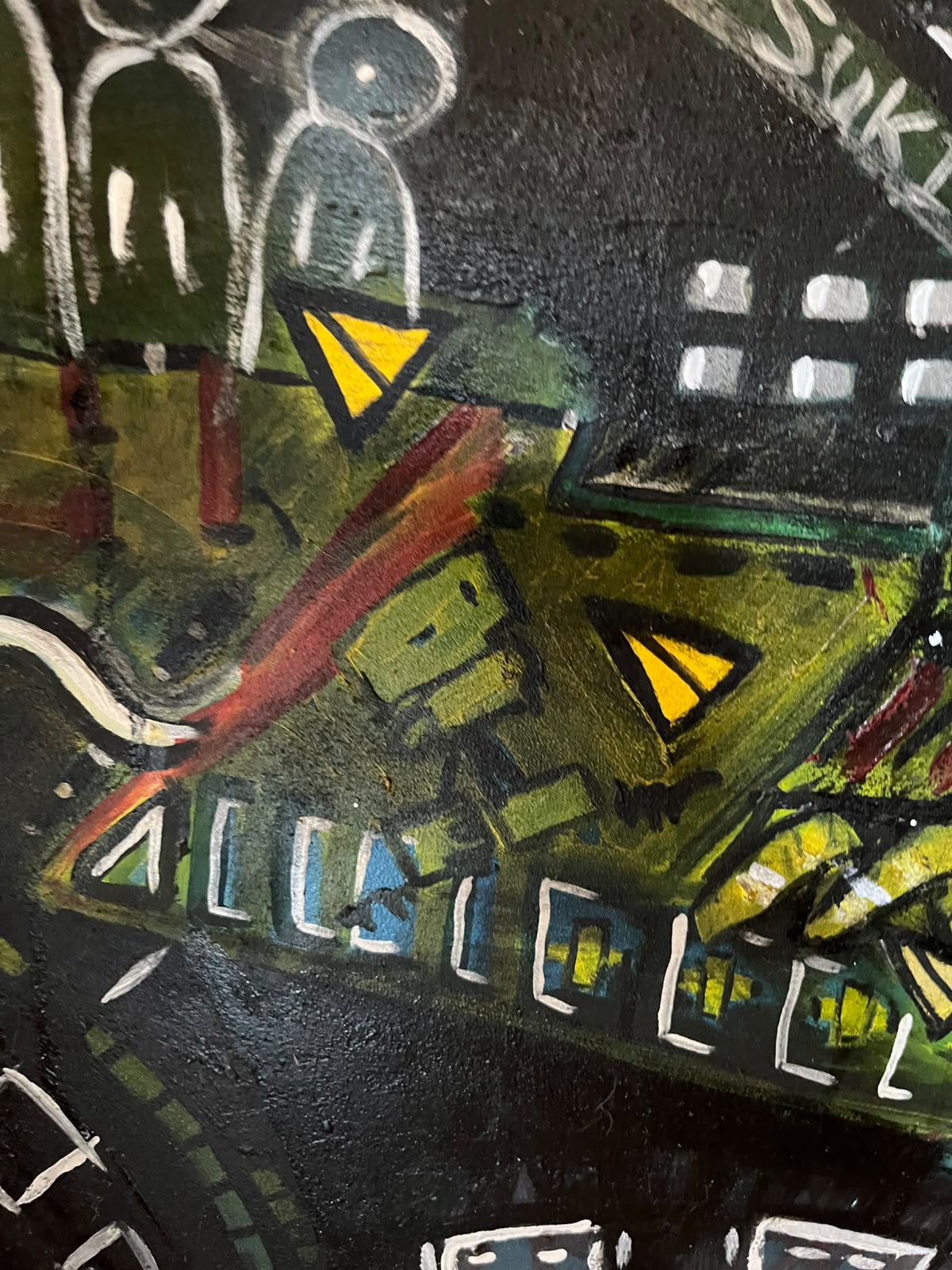 Detail — figure above green and yellow blocks