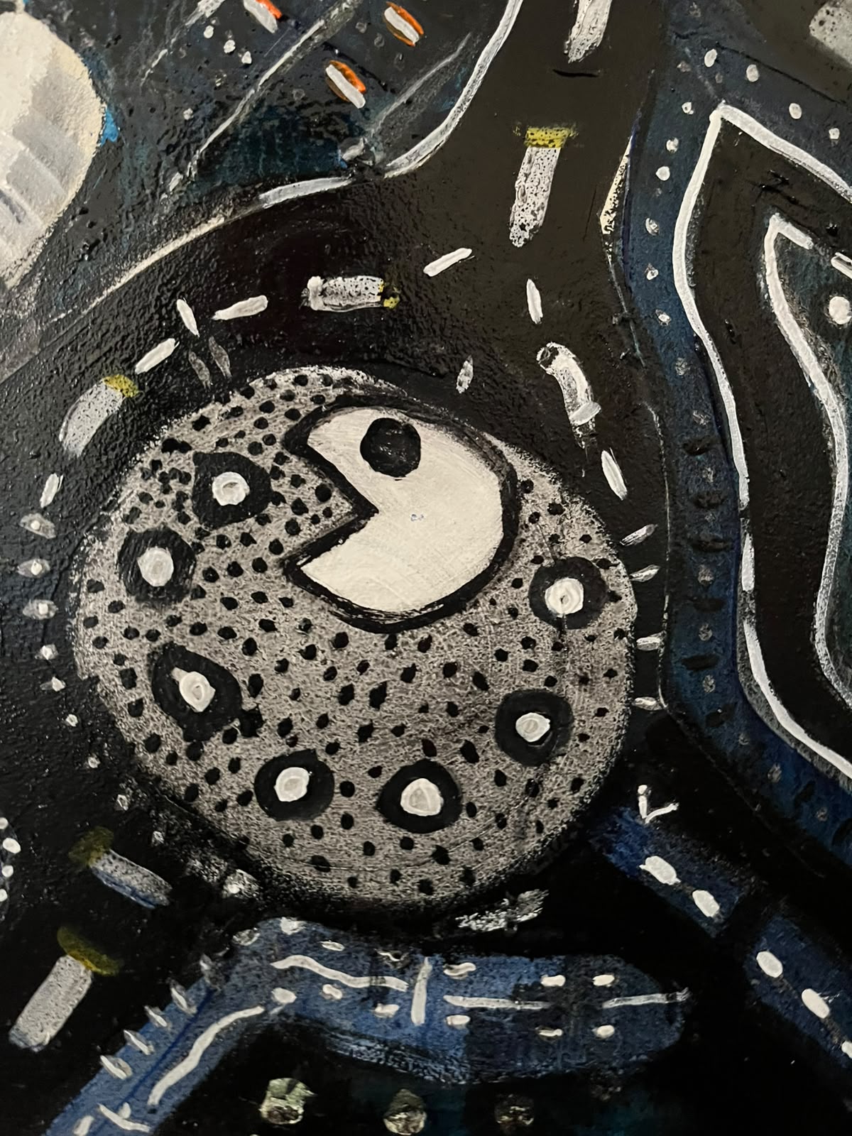 Detail — spotted sphere creature in the dark