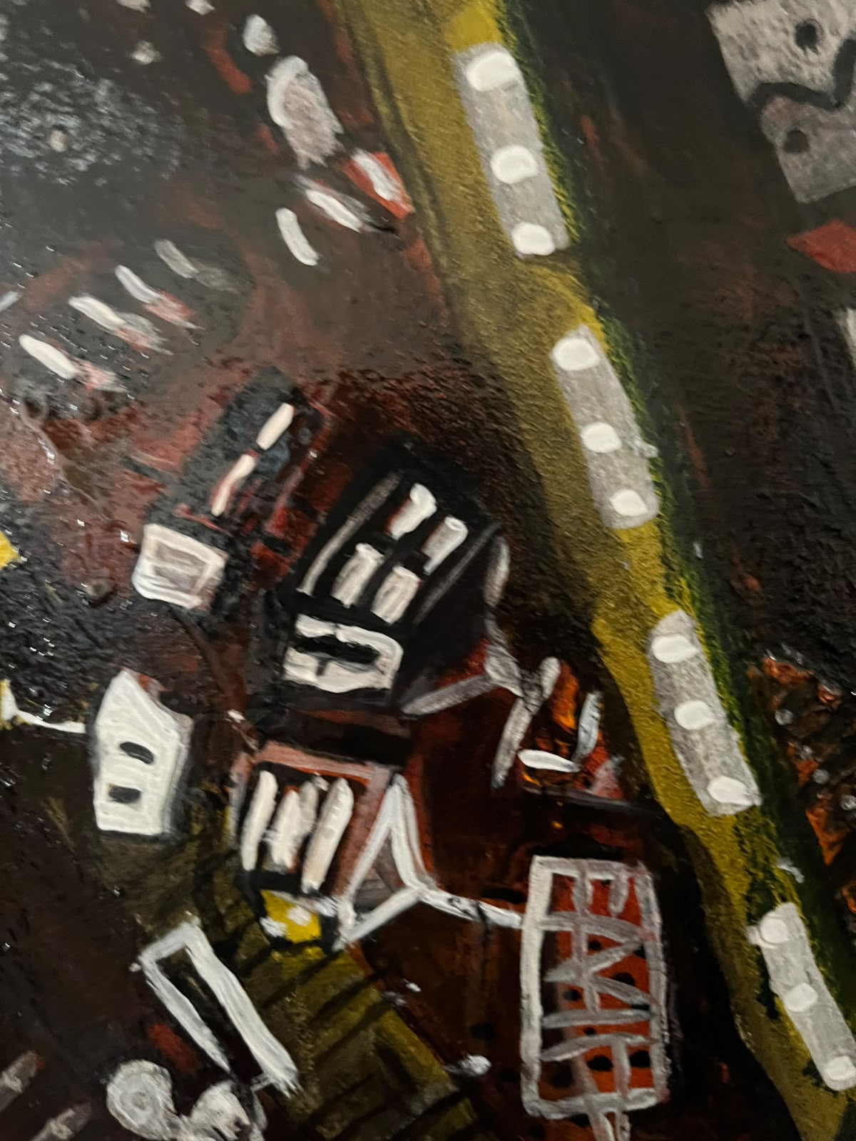 Detail — red buildings along a yellow road with lights