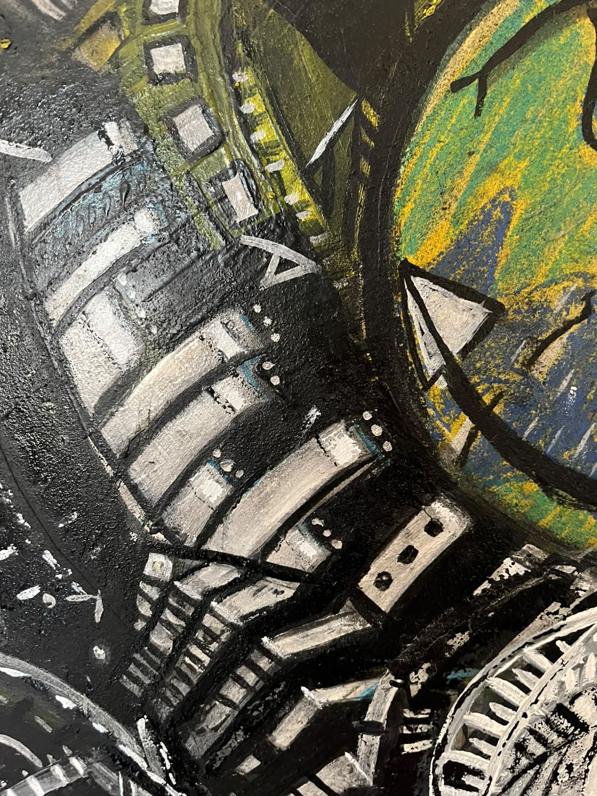 Detail — curved film-strip structures and green circle
