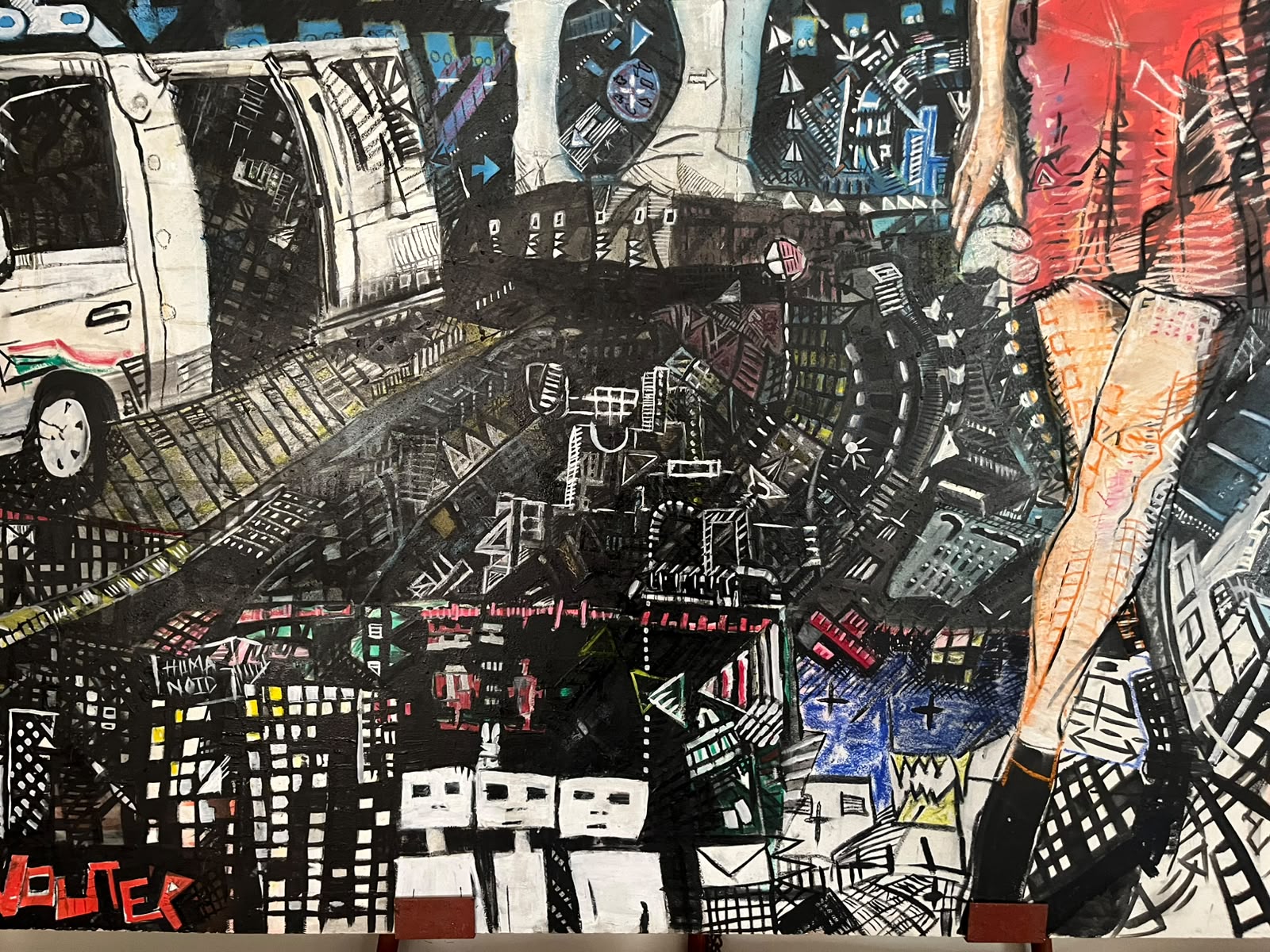 Humanoid — full painting: a dense mixed-media cityscape with a van, towers and a figure in red